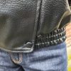 Veste simili cuir noire structurée, effet cuir texturé, coupe oversize, col montant avec boutons, fermeture zip frontal avec rabat asymétrique. Taille unique