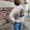 Sweat oversize imprimé soleil, disponible en noir et beige. manches longue, col rond. Taille unique (convient du 34 au 42)